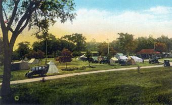 A painting of a large campsite off the Highway